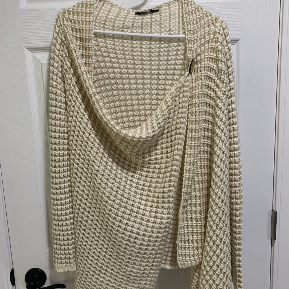 A phenomenal look leader, BCBG open knit  neckline with wraps with one button!